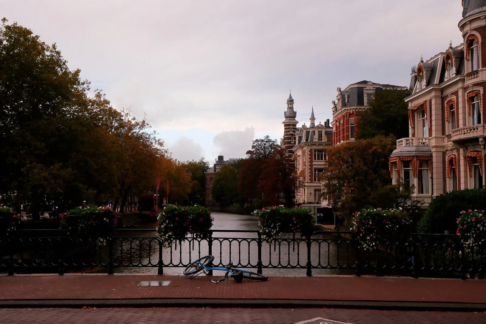 Ornate riverside buildings along a canal in County Cork, autumn light on the water.